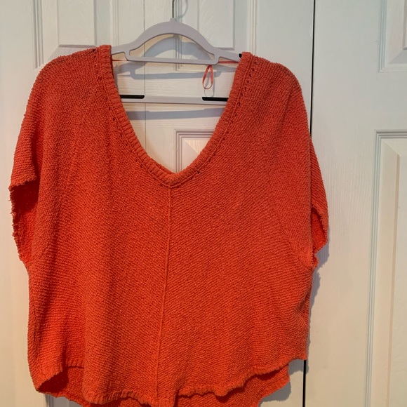 Free people short sleeve, double V sweater in coral orange. - Picture 2 of 3